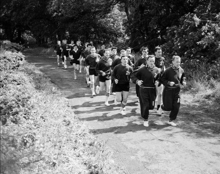 Hearts football players training - John Cumming leads his colleagues