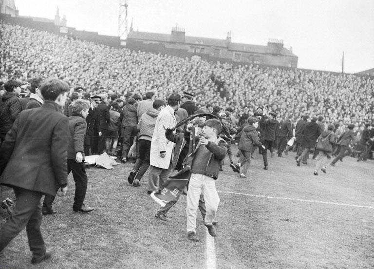 Police supporters inading the pitch Tynecastle Hearts Celtic