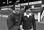 Hearts goalkeeper Jim Cruickshank welcomes Malcolm Robertson to the team when he signs on at Tynecastle in March 1977.