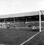 Jim Cruickshank makes a save from Hibs' Peter Cormack