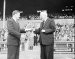 Willie Bauld receives testimonial match cheque from Mr W Strachan at Tynecastle