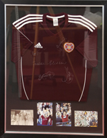 Framed Strip signed by the captains from Scottish Cup wins in 1956, 1998, 2006 and 2012 